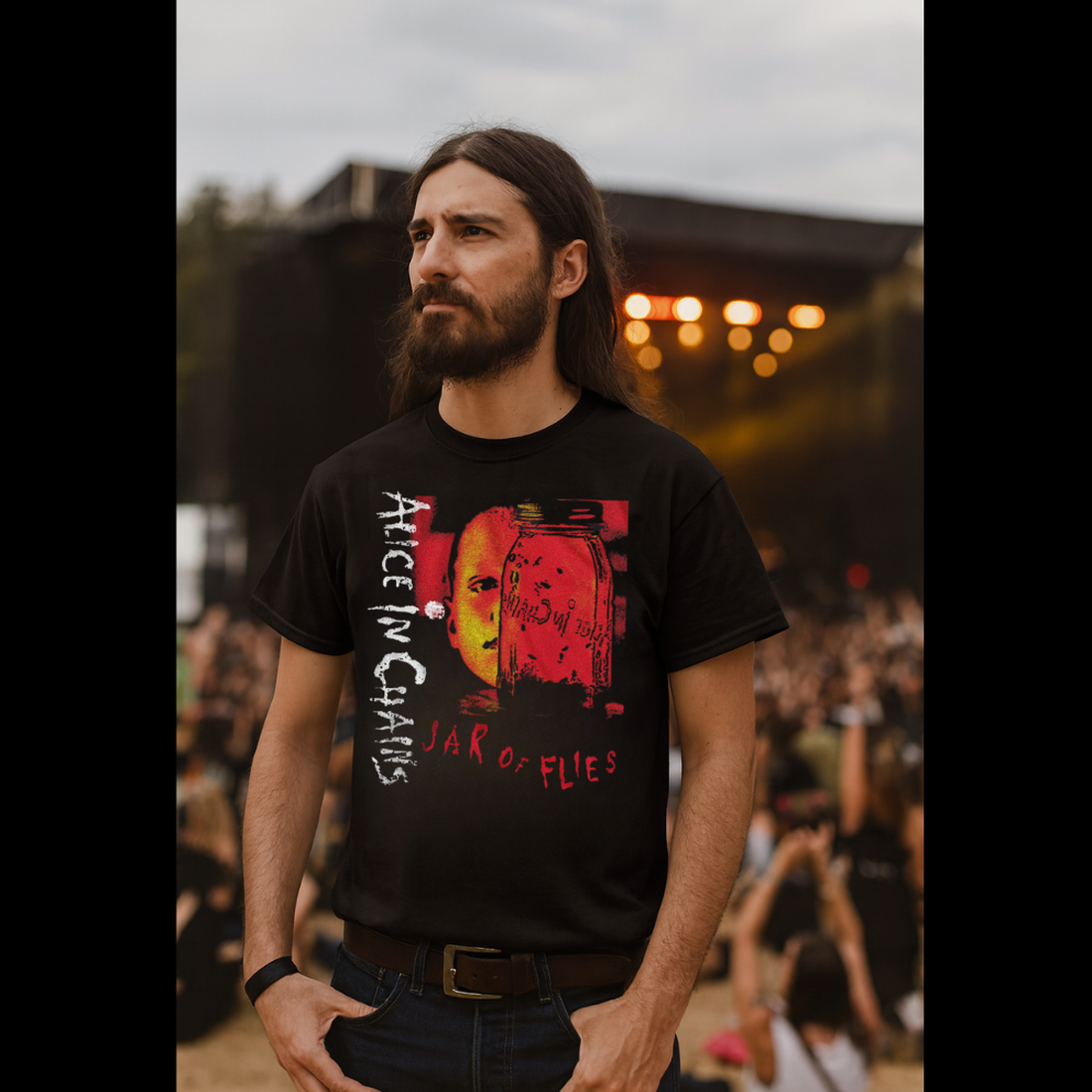 Man wearing a black t-shirt with 'Alice in Chains' design at a concert. AIC503S, AIC503M, AIC503L, AIC503XL, AIC503XXL, AIC503XXXL, AIC503XXXXL, AIC503XXXXXL