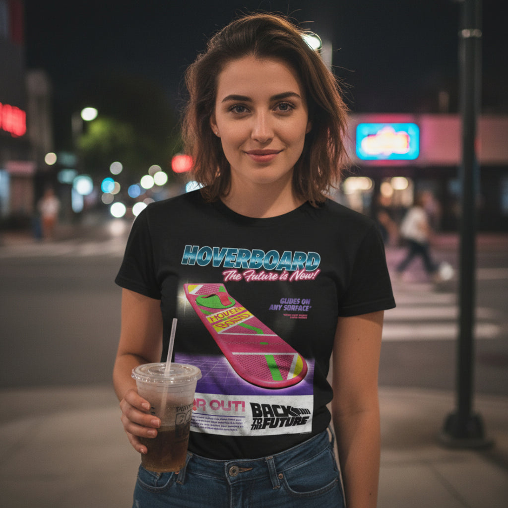 GIRL WEARING Black t-shirt with 'Back to the Future' hoverboard graphic and text. BTF5465S, BTF5465M, BTF5465L, BTF5465XL, BTF5465XXL, BTF5465XXXL, BTF5465XXXXL, BTF5465XXXXXL