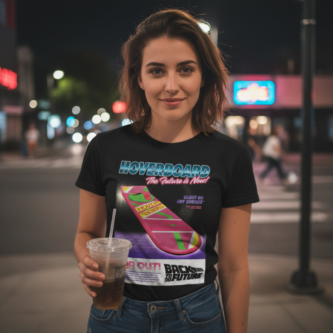 GIRL WEARING Black t-shirt with 'Back to the Future' hoverboard graphic and text. BTF5465S, BTF5465M, BTF5465L, BTF5465XL, BTF5465XXL, BTF5465XXXL, BTF5465XXXXL, BTF5465XXXXXL