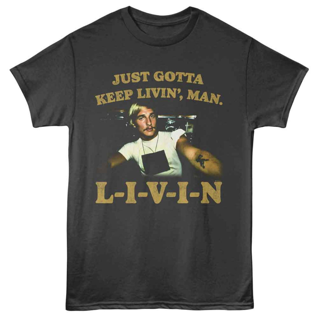 Black t-shirt with a graphic of a man and text 'Just Gotta Keep Livin', Man. L-I-V-I-N' on a white background.