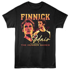 Black t-shirt with 'Finnick' and 'Odair' graphic from 'The Hunger Games' on a white background