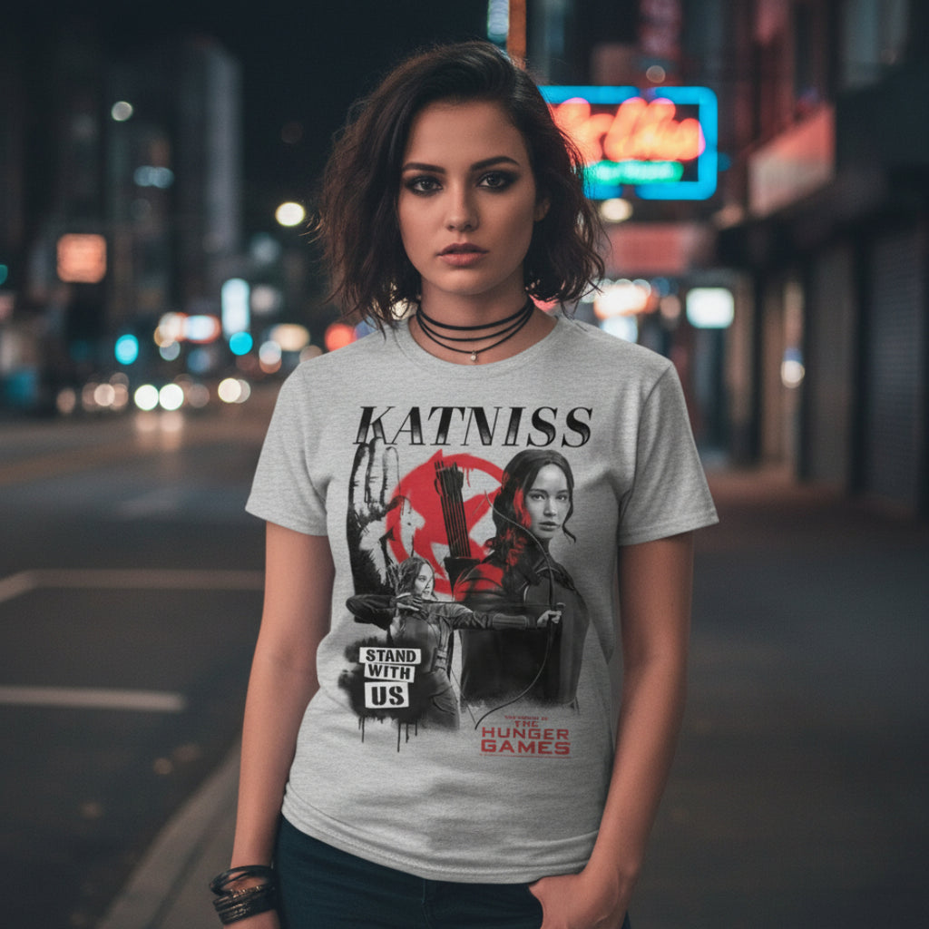 GIRL WEARING Gray t-shirt with 'Katniss' graphic design from 'The Hunger Games' HGAM579S, HGAM579M, HGAM579L, HGAM579XL, HGAM579XXL, HGAM579XXXL, HGAM579XXXXL, HGAM579XXXXXL