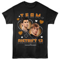 Black hunger games t-shirt with 'Team District 12' design featuring two characters and hearts, inspired by 'The Hunger Games'.