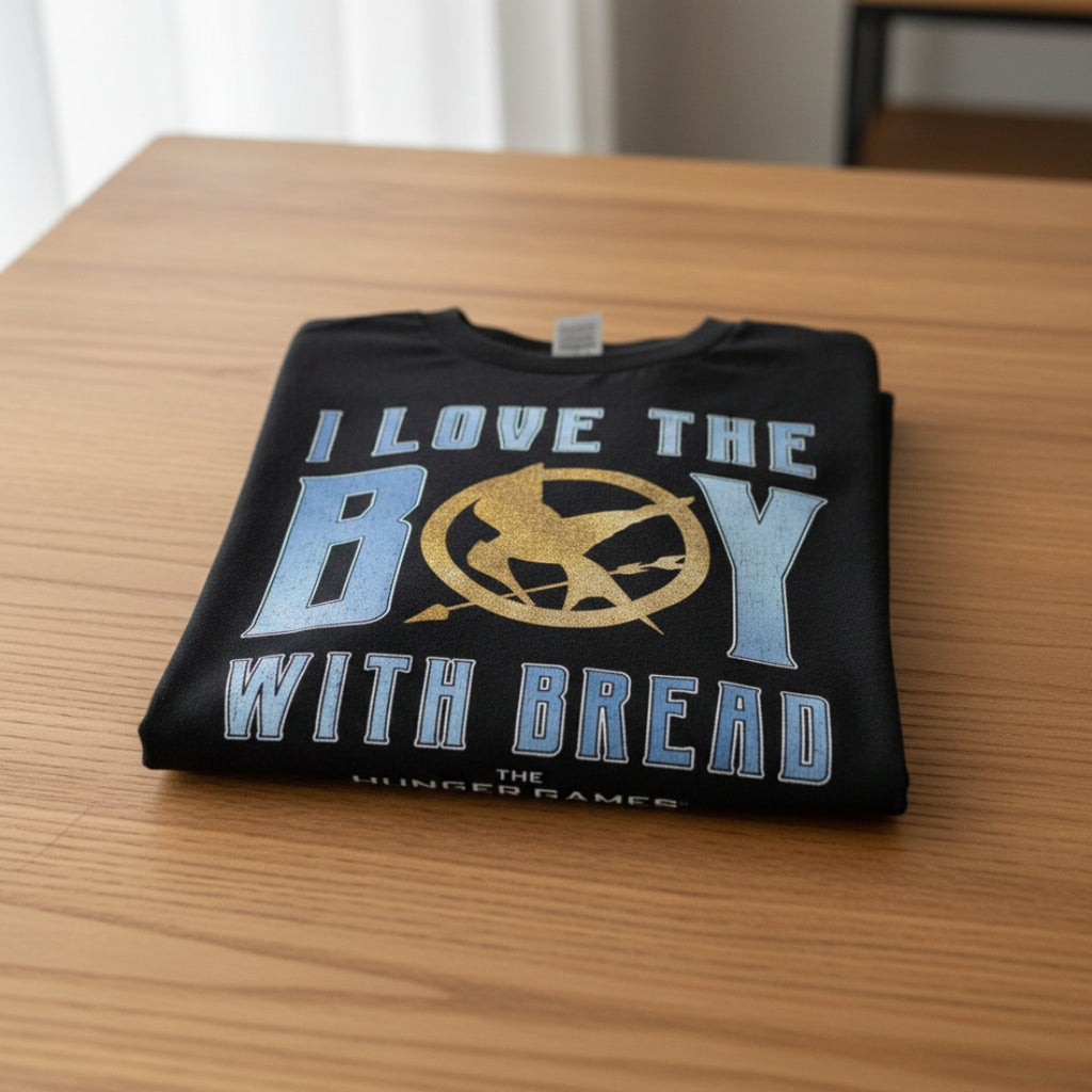 FOLDED Black t-shirt with 'I Love the Boy with Bread' text and Hunger Games logo HGAM584S, HGAM584M, HGAM584L, HGAM584XL, HGAM584XXL, HGAM584XXXL, HGAM584XXXXL, HGAM584XXXXXL
