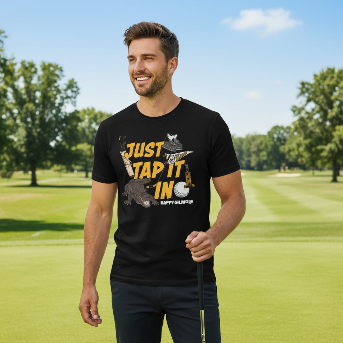 Man wearing Black t-shirt with 'Just Tap It In' graphic and 'Happy Gilmore' text  HGIL548S, HGIL548M, HGIL548L, HGIL548XL, HGIL548XXL, HGIL548XXXL, HGIL548XXXXL, HGIL548XXXXXL