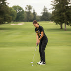 Woman wearing Black t-shirt with 'Just Tap It In' graphic and 'Happy Gilmore' text HGIL548S, HGIL548M, HGIL548L, HGIL548XL, HGIL548XXL, HGIL548XXXL, HGIL548XXXXL, HGIL548XXXXXL