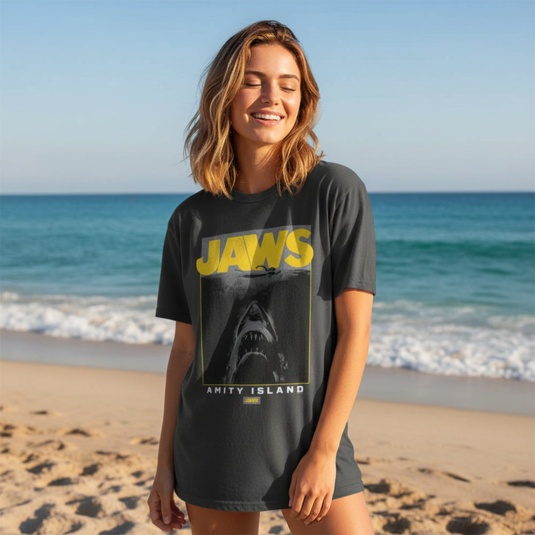 Woman wearing Black t-shirt with 'JAWS' graphic and shark image  JAW5562S, JAW5562M, JAW5562L, JAW5562XL, JAW5562XXL, JAW5562XXXL
