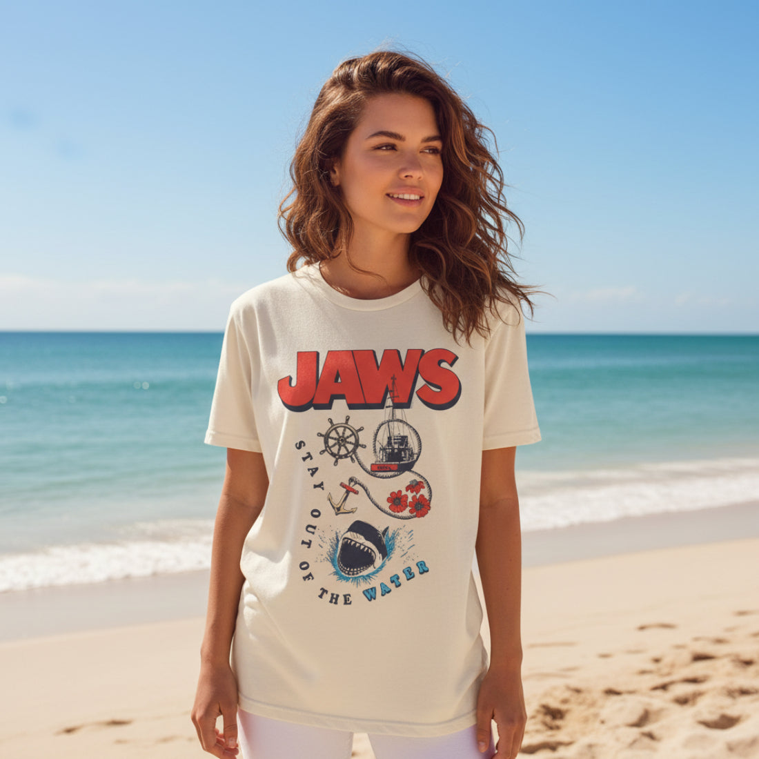 Woman wearing Beige t-shirt with 'JAWS' graphic design featuring a shark, anchor, and ship JAW5567S, JAW5567M, JAW5567L, JAW5567XL, JAW5567XXL, JAW5567XXXL, JAW5567XXXXL