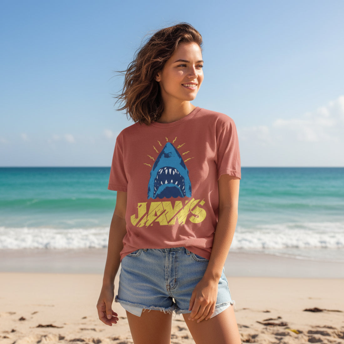 Woman wearing Red t-shirt with a shark graphic and 'JAWS' text JAW5570S, JAW5570M, JAW5570L, JAW5570XL, JAW5570XXL