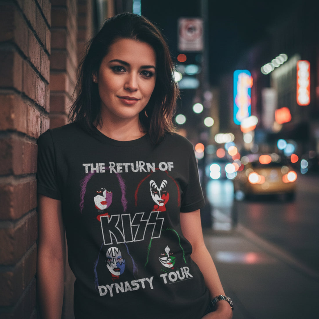 WOMAN WEARING Black t-shirt with Kiss band members' faces and 'The Return of Kiss Dynasty Tour' text KISS553S, KISS553M, KISS553L, KISS553XL, KISS553XXL