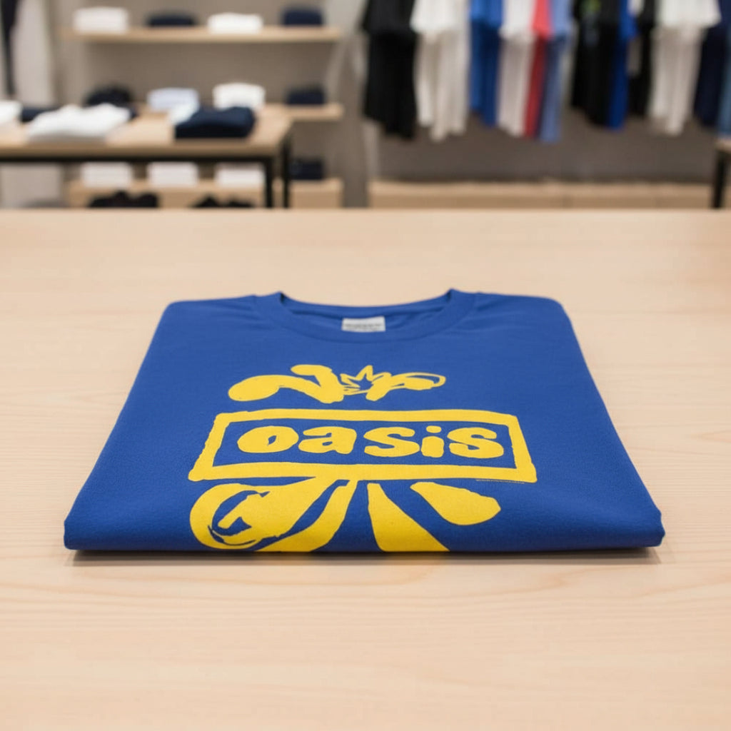 Blue t-shirt with yellow 'oasis' logo folded on a table OAS525S, OAS525M, OAS525L, OAS525XL, OAS525XXL, OAS525XXXL, OAS525XXXXL, OAS525XXXXXL