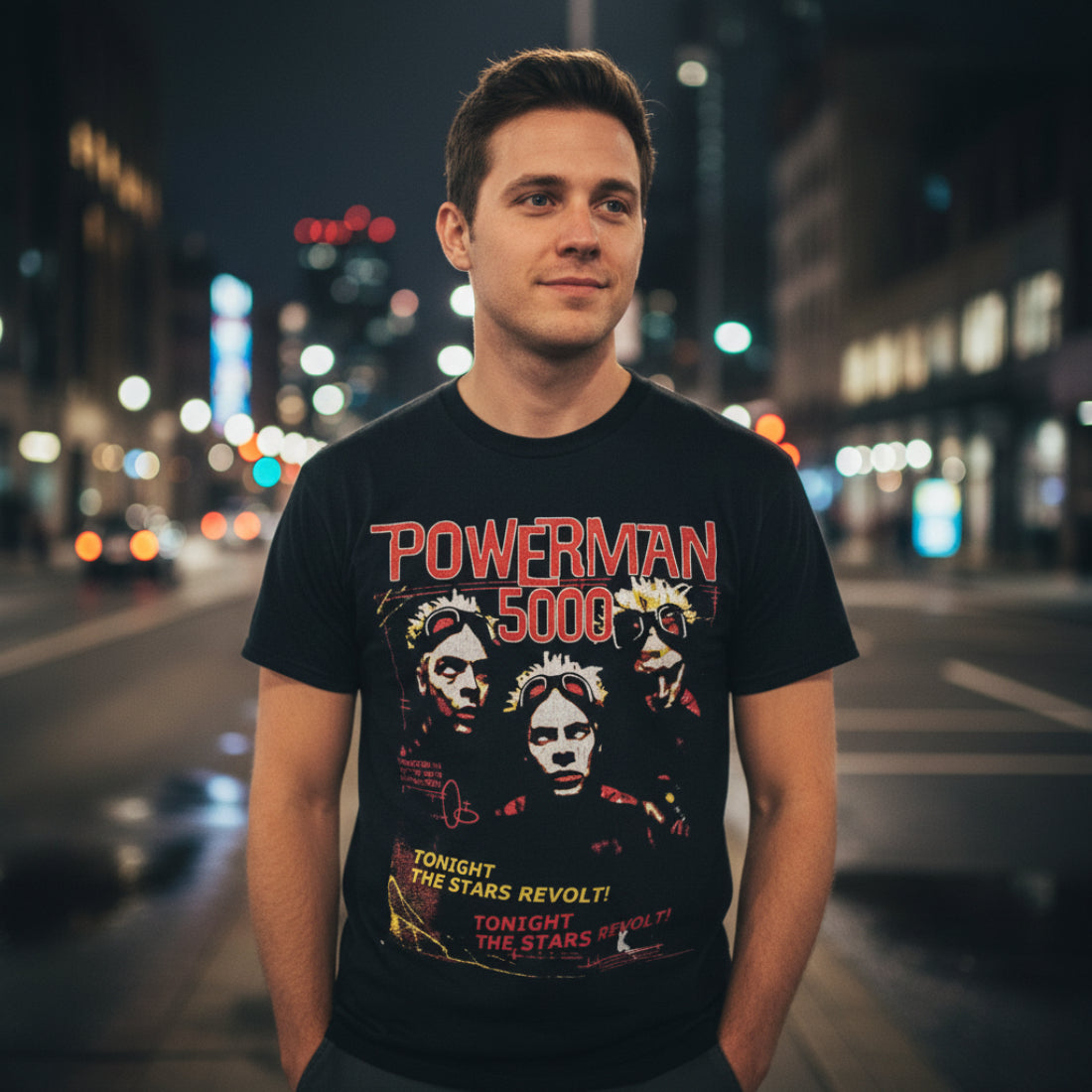 MAN WEARING Black t-shirt with 'Powerman 5000' graphic design featuring two faces and text on a white background. PMF503S, PMF503M, PMF503L, PMF503XL, PMF503XXL, PMF503XXXL, PMF503XXXXL, PMF503XXXXXL