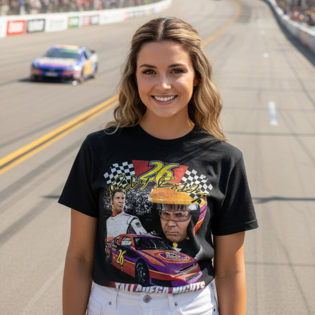 woman wearing Black t-shirt with 'Talladega Nights' graphic featuring a race car and two men. TDN557S, TDN557M, TDN557L, TDN557XL, TDN557XXL, TDN557XXXL, TDN557XXXXL, TDN557XXXXXL