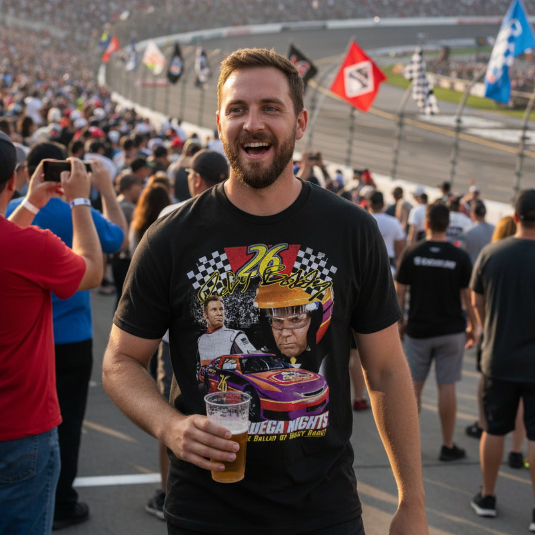man wearing Black t-shirt with 'Talladega Nights' graphic featuring a race car and two men. TDN557S, TDN557M, TDN557L, TDN557XL, TDN557XXL, TDN557XXXL, TDN557XXXXL, TDN557XXXXXL
