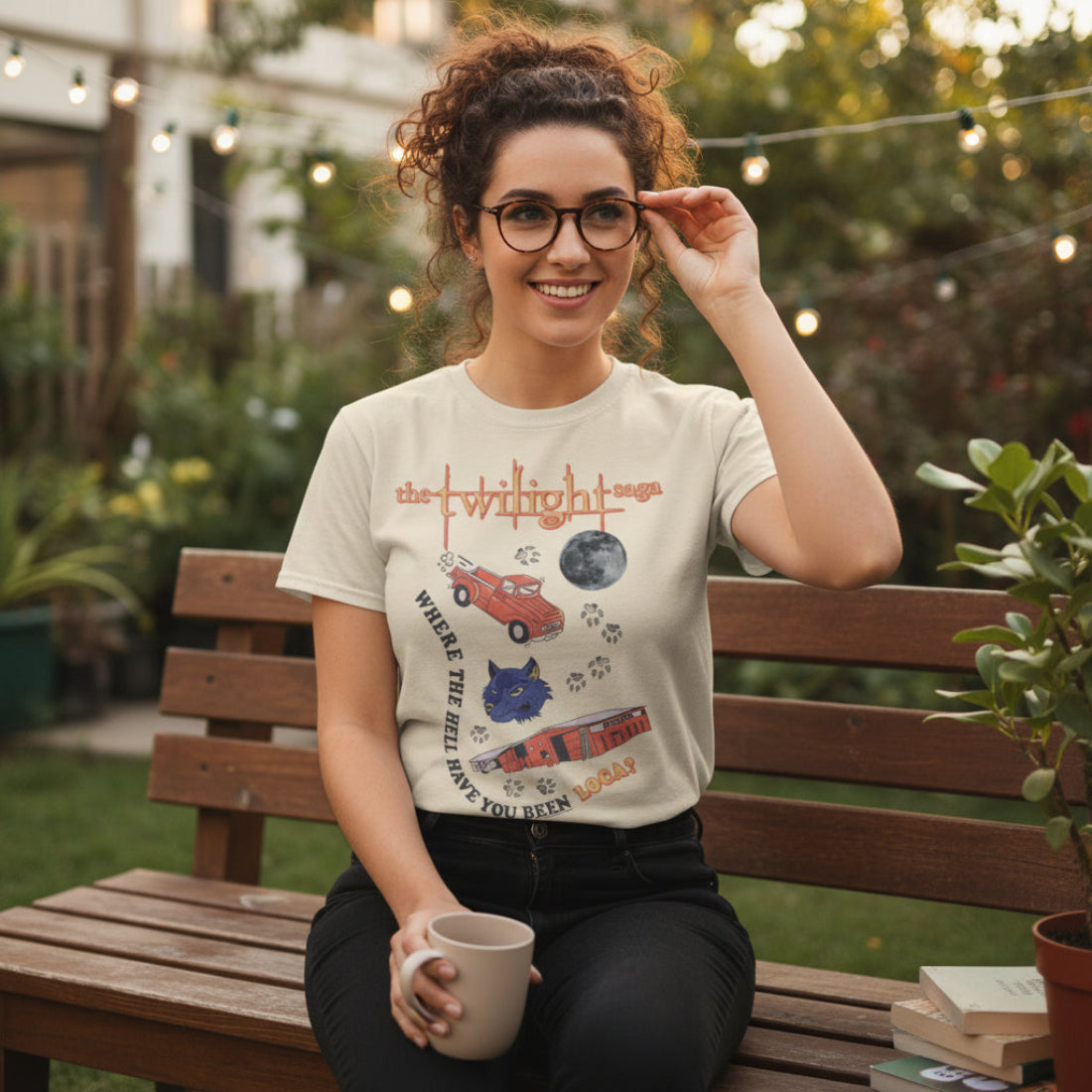 Woman wearing Beige t-shirt with 'Twilight Saga' graphic design featuring a cat, truck, and text. TWI5145S, TWI5145M, TWI5145L, TWI5145XL, TWI5145XXL, TWI5145XXXL, TWI5145XXXXL