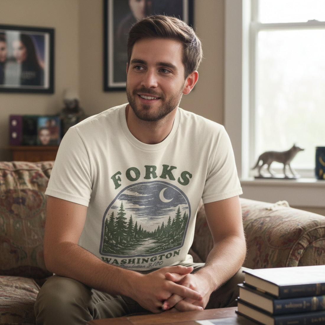Man wearing Beige Twilight Saga t-shirt with 'Forks, Washington' graphic design featuring trees and a crescent moon. TWI5147S, TWI5147M, TWI5147L, TWI5147XL, TWI5147XXL, TWI5147XXXL, TWI5147XXXXL