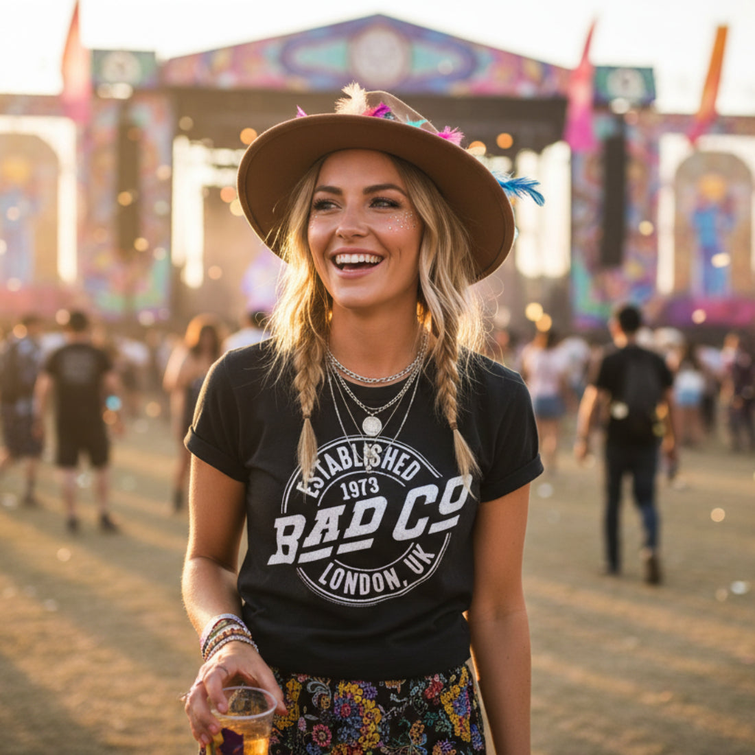 WOMAN WEARING Black t-shirt with 'Bad Co' logo on a white background BCO501S, BCO501M, BCO501L, BCO501XL, BCO501XXL, BCO501XXXL, BCO501XXXXL, BCO501XXXXXL