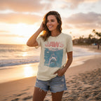 Woman weariung T-shirt with 'JAWS' graphic design featuring a shark and ocean scene JAW5224JS, JAW5224JM, JAW5224JL, JAW5224JXL, JAW5224JXXL