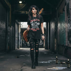 Woman wearing Black t-shirt with 'Motley Crue World Tour 1986' design MCRU509S, MCRU509M, MCRU509L, MCRU509XL, MCRU509XXL, MCRU509XXXL, MCRU509XXXXL, MCRU509XXXXXL